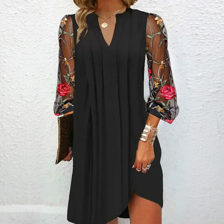 Women's elegant mini dress with V-neck and transparent