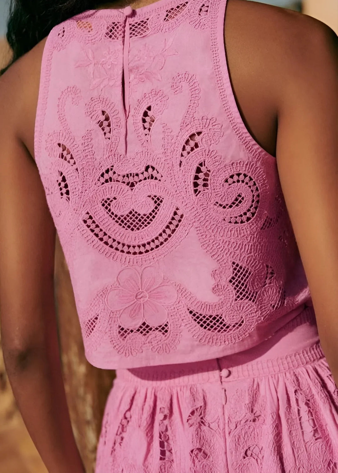 Women's sleeveless crop top and high-waisted lace skirt